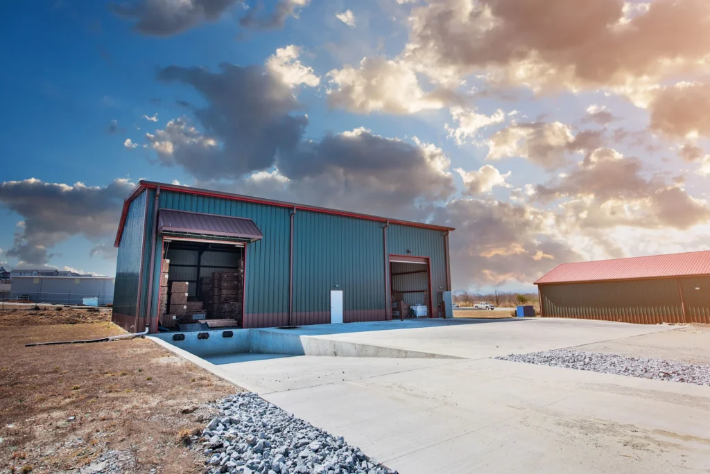 Turnkey metal warehouse building with loading bays and concrete drive in Asheville, NC.